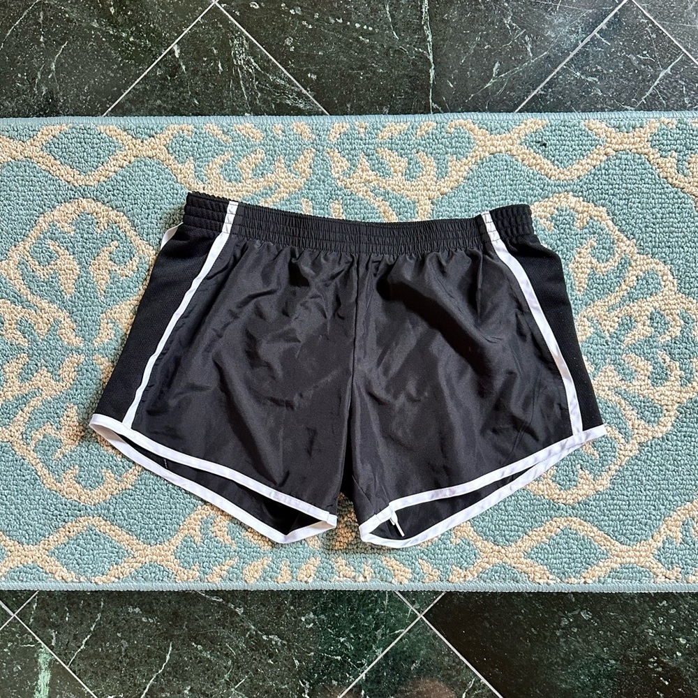 Black athletic shorts with white trim
